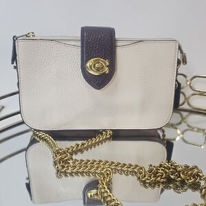 Coach 1941 colorblock leather crossbody with a turn-lock closure & gold chain